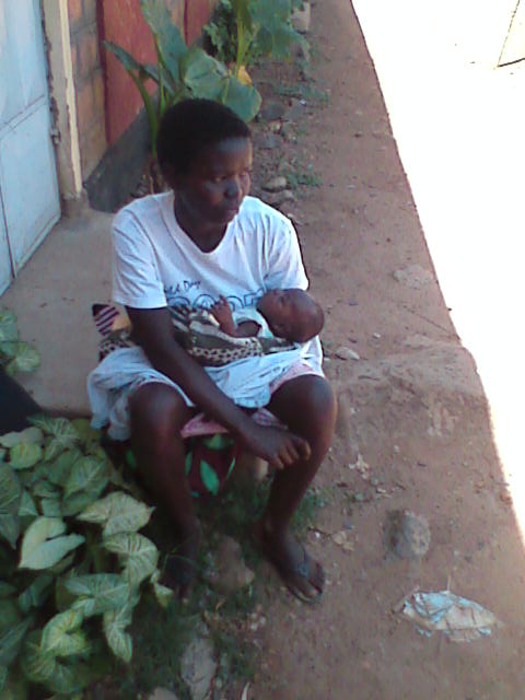 Lysianne waits to gets her medication at the Rota Clinic